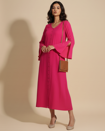 Woman wearing a bright pink dress with a brown handbag on a beige background